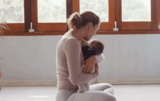 A postpartum woman receiving a CoolTone abdominal treatment at a CoolTone treatment center.