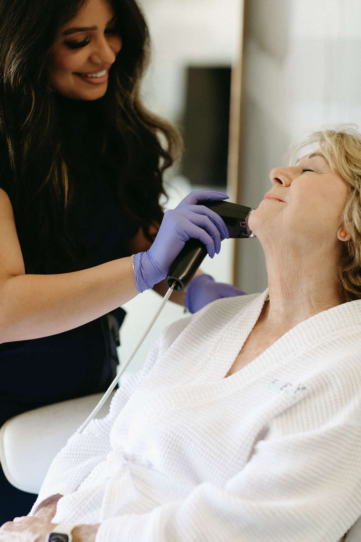 Woman receiving Morpheus8 treatment at Bodify to tighten sagging skin and smooth wrinkles. Schedule your consultation and glow naturally.